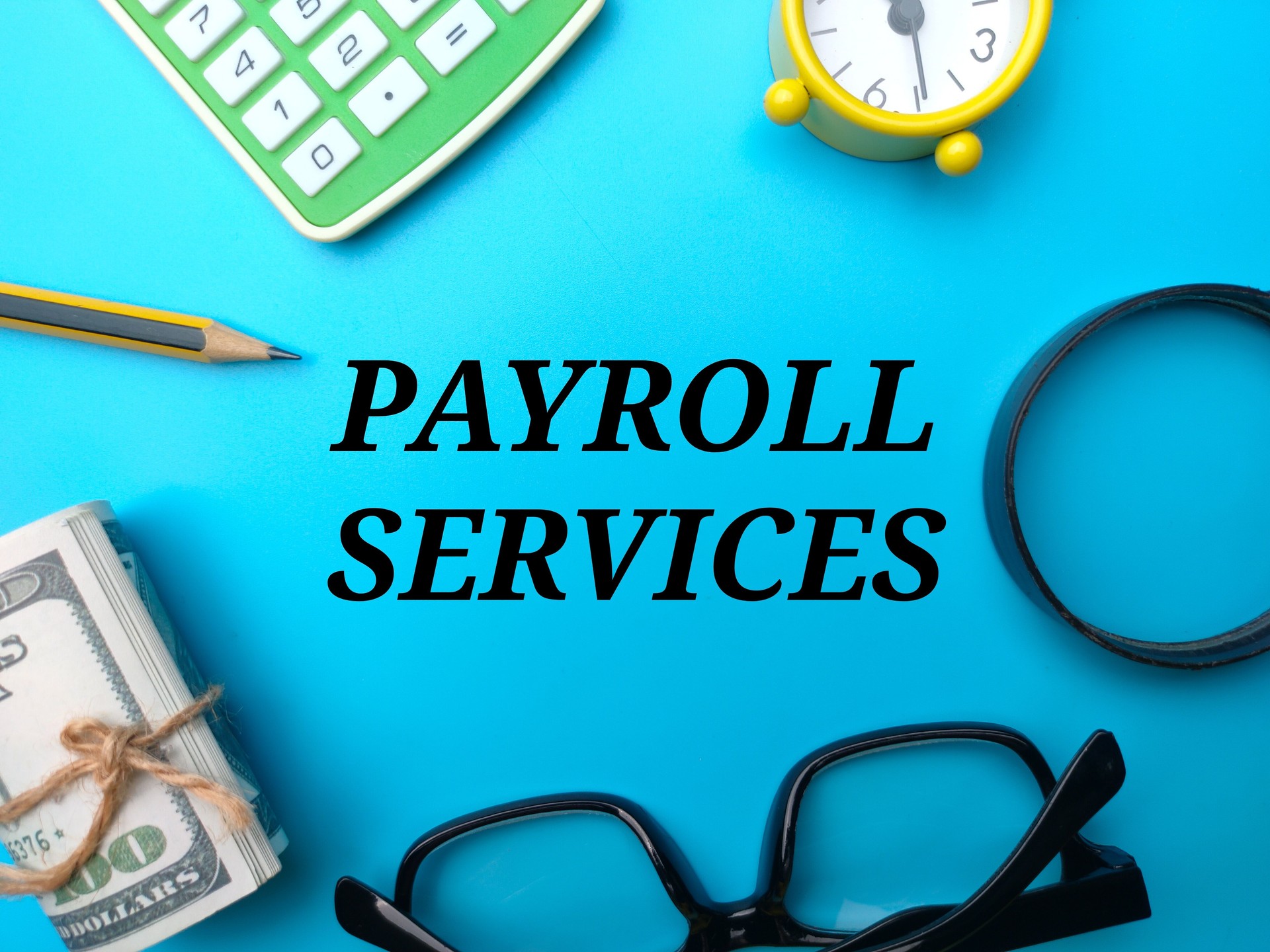 Top view business concept. The word PAYROLL SERVICES on blue background.